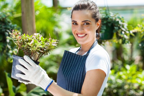 Gardeners arranging green waste for recycling at Wembley site