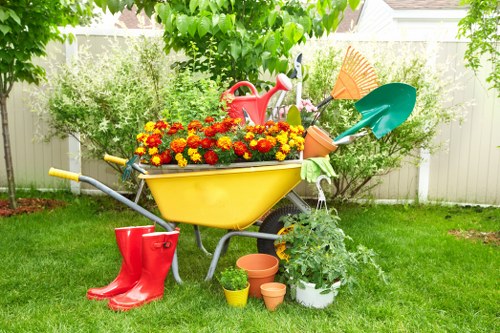 Gardener preparing tools in a Wembley front garden