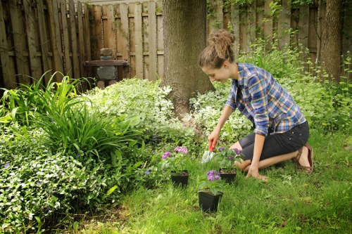 Separated garden waste and recyclable containers prepared for collection
